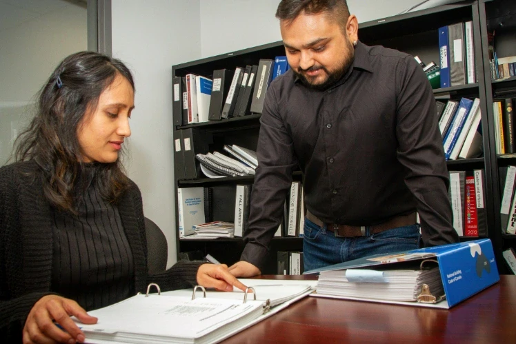 engineers discussing on national building code of Canada